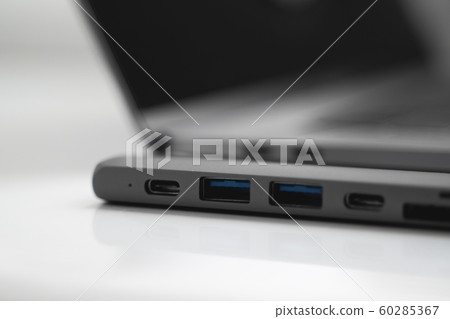 The USB adapter under the Type-C connector for laptop. Multiport station for laptop with multiple different ports. USB to USB Type-C Hub Converter. Gadgets for use a modern laptop. 60285367