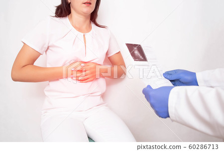 The doctor diagnoses a girl with a spleen problem, splenomegaly, organ enlargement. Body responsible for immunity and blood composition 60286713