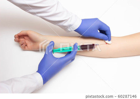 Doctor takes blood from a girl's vein for immunoglobulins and hepatitis, reaction to allergens, copy space, immunogram Doctor takes blood from a girl's vein for immunoglobulins and hepatitis, reaction to allergens, copy space, immunogram 60287146