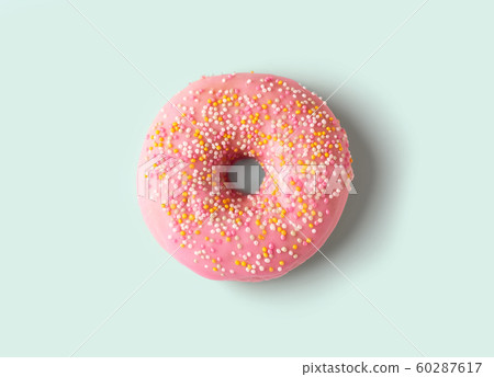 freshly baked donut isolated on blue background, top view 60287617