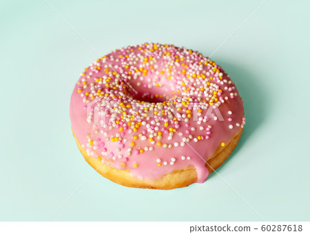 freshly baked donut isolated on blue background, top view freshly baked donut isolated on blue background, top view 60287618