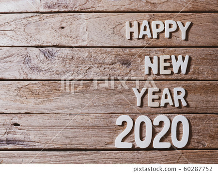 happy new year 2020 alphabet on old wood background happy new year 2020 alphabet on old wood background 60287752