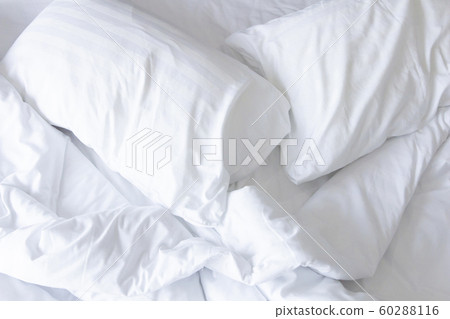 Close up white bedding sheets and pillow .   60288116