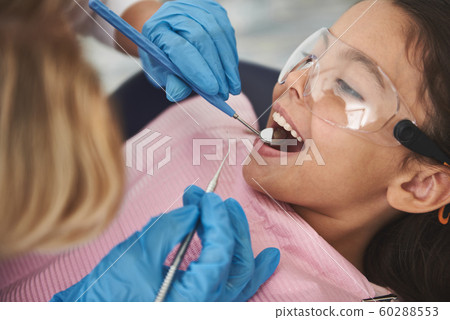 Close up of a nice little girl visiting her stomatologist 60288553