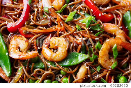 Stir fry noodles with vegetables and shrimps. Close up. 60288620
