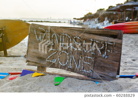 Windsurf zone wooden beach sign. Summer sea shore background. 60288829