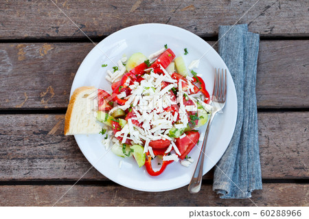 Vegetable Bulgarian Shopska salad. Wooden background. Top view. 60288966