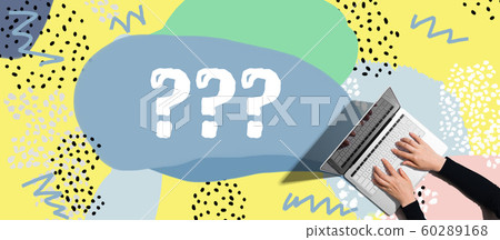 Question marks with person using laptop 60289168