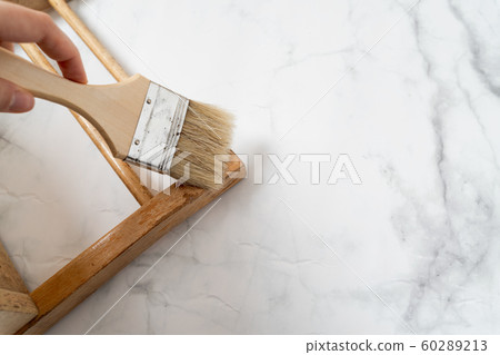 Upcycling concept. Flat lay on marble background. Mid century chair and tools. Top view 60289213