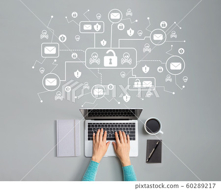 Email virus and scam theme with person using laptop Email virus and scam theme with person using laptop 60289217