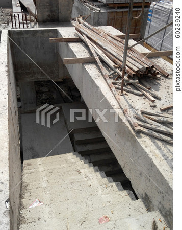 Concrete staircase under construction at the construction site. Timber formwork fabricated by construction workers as the staircase mold. Concrete staircase under construction at the construction site. Timber formwork fabricated by construction workers as the staircase mold. 60289240