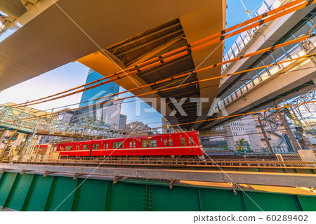 View of Yokohama cityscape in Japan, Yokohama Station and trains taking the sunset View of Yokohama cityscape in Japan, Yokohama Station and trains taking the sunset 60289402