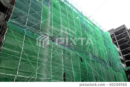 Plastic or nylon netting erected at the external of the under-construction building to prevent construction debris from falling down. Temporary installed. 60289568