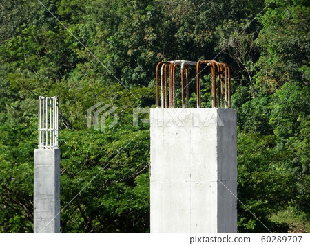 Building reinforcement concrete structure at the construction site. Post, beam and slab constructed using timber formwork by construction workers.  60289707