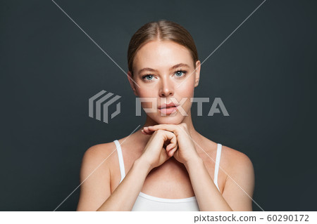 Cute young woman on gray background 60290172