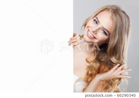 Blonde woman with empty white placard signboard Blonde woman with empty white placard signboard 60290340