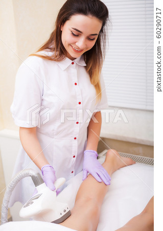 Body Care. Beautician Giving Epilation Laser Treatment To Woman On Leg 60290717