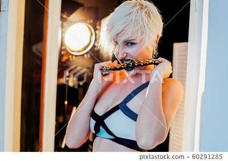 blonde girl with short hair posing fashion 60291285