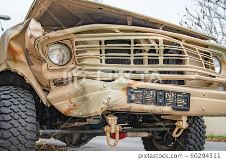 crashed car near brick fence in village waiting for repair crashed car near brick fence in village waiting for repair 60294511