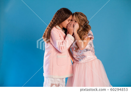 Portrait of two beautiful fashionable girl girlfriends in white pink clothes 60294853