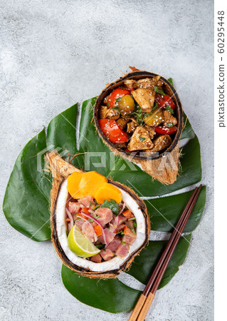 Tahitian Hawaiian dishes Thuna ceviche salad and pineapple chicken with sweet sauce Tahitian Hawaiian dishes Thuna ceviche salad and pineapple chicken with sweet sauce 60295448
