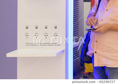 Charging station for mobile devices in modern waiting air plane in the airport Charging station for mobile devices in modern waiting air plane in the airport 60296557