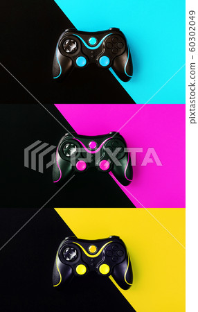 Three Gaming joysticks isolated on a colored Three Gaming joysticks isolated on a colored 60302049