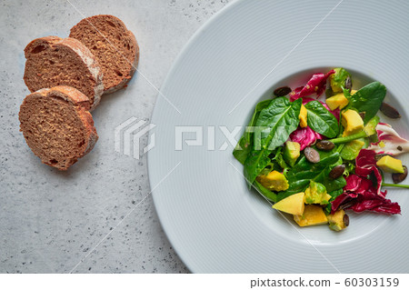 Pumpkin and spinach vegeterian healthy salad 60303159