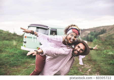 Happy ethnicity couple having fun on nature hills 60305722