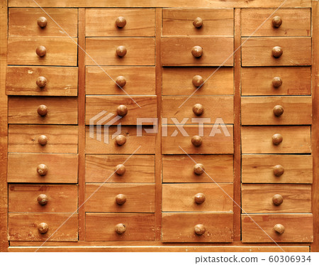 Wooden cabinet with opened drawers Wooden cabinet with opened drawers 60306934