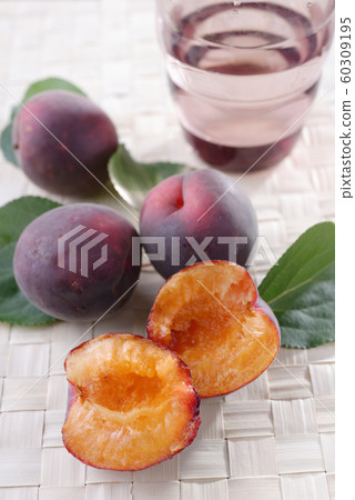 Black apricots on a rustic table Black apricots on a rustic table 60309195