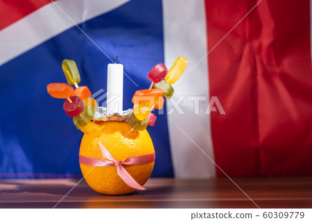 Orange Christingle is a symbolic object used in the Advent, Christmas and Epiphany services of many Christian denominations 60309779