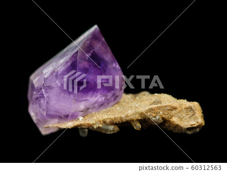 Amethyst crystal isolated on black 60312563