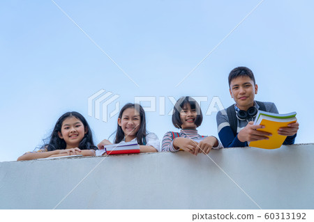 Group of students laugh happy standing together Group of students laugh happy standing together 60313192