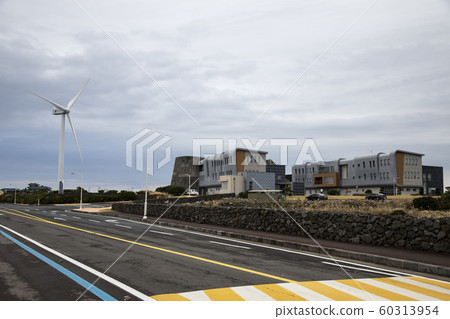Jeju Island coastal road with windmills 60313954
