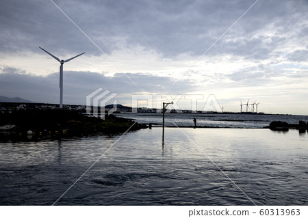 Jeju Island coast with wind turbines 60313963