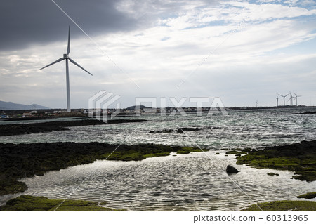 Jeju Island coast with wind turbines 60313965