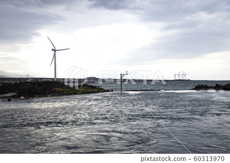 Jeju Island coast with wind turbines 60313970