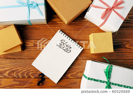 Prepare for Christmas with Notepad and gifts. 60320889