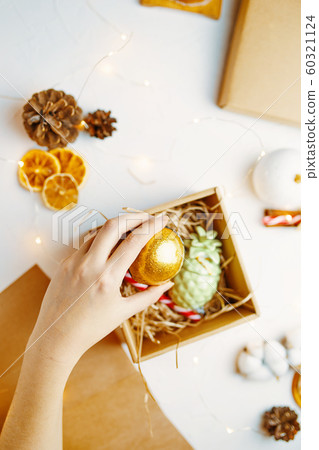 Process of packing gifts for holidays. 60321124