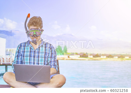 A man is working on vacation. A man is working on vacation. 60321258