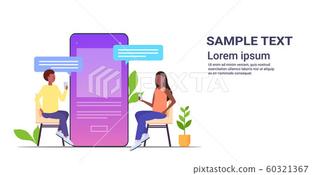 couple using chatting app social network chat bubble communication concept african american man woman near smartphone screen online mobile application full length horizontal 60321367