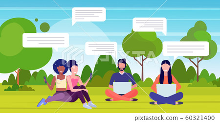people using chatting apps on digital devices social network speech chat bubble communication concept mix race men women sitting on green grass in park horizontal full length people using chatting apps on digital devices social network speech chat bubble communication concept mix race men women sitting on green grass in park horizontal full length 60321400