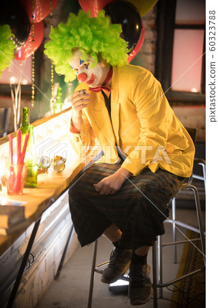 Clown concept - a lost man clown in yellow... - Stock Photo [60323788]