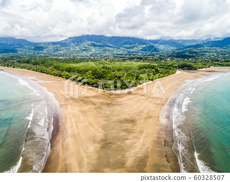 Aerial view National Park Punta Uvita Beautiful beach tropical forest pacific coast Costa Rica shape whale tail Aerial view National Park Punta Uvita Beautiful beach tropical forest pacific coast Costa Rica shape whale tail 60328507