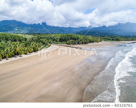 Aerial view National Park Punta Uvita Beautiful beach tropical forest pacific coast Costa Rica shape whale tail Aerial view National Park Punta Uvita Beautiful beach tropical forest pacific coast Costa Rica shape whale tail 60328761