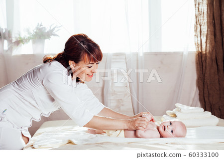 the little boy baby mother doing massage hands and legs the little boy baby mother doing massage hands and legs 60333100