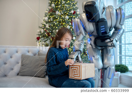 Adorable girl feeling wonderful during christmas eve 60333999