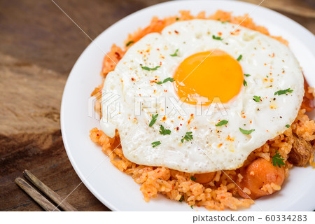 Kimchi fried rice with fried egg on top, Korean food Kimchi fried rice with fried egg on top, Korean food 60334283