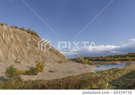 Mountain of white sand. A white mountain of white stones in Rummu Vasalema Estonia. Mountain of white sand. A white mountain of white stones in Rummu Vasalema Estonia. 60334738